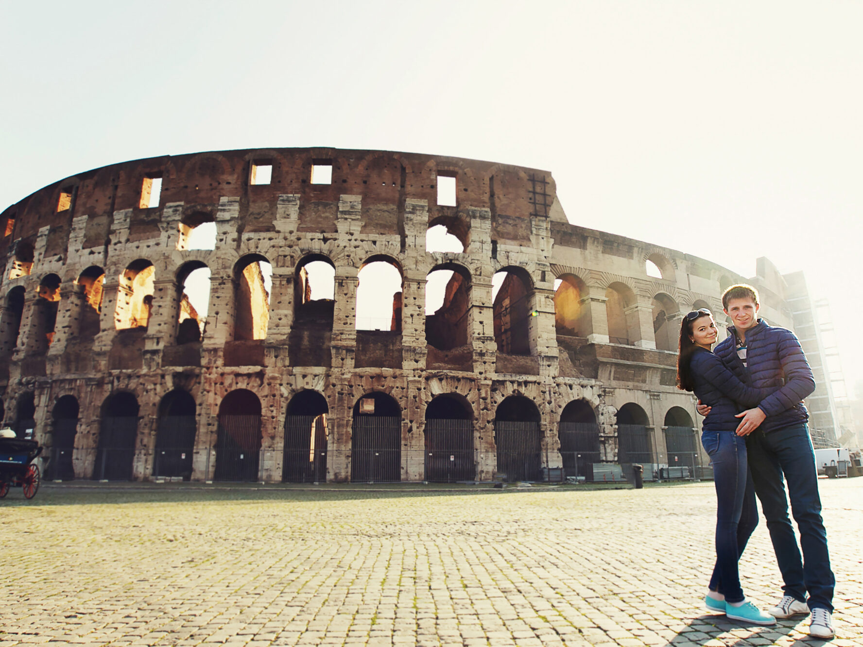 two-people-standing-near-coliseum-rome-2